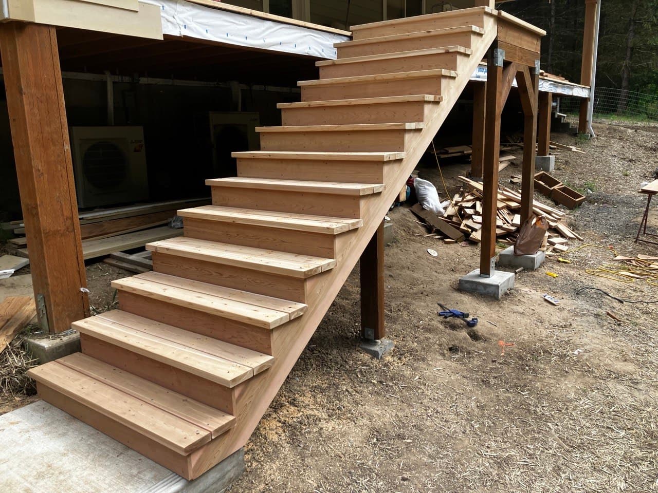 Exterior stair replacement — new fir staircase to a deck, mid-build by Stumptown Stairs, Portland, OR